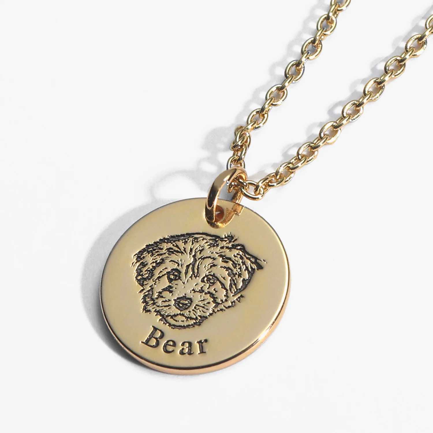 Engraved gold pet memorial pendant with pet's portrait and name
